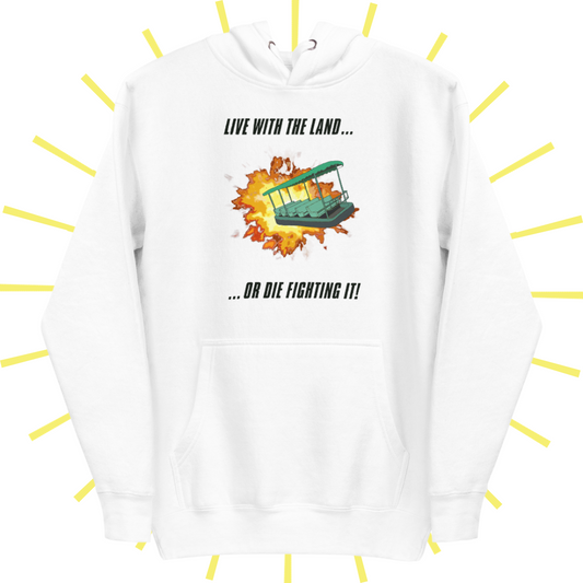 A white hoodie (hood tucked behind) with a front pouch. The design includes top text in bold, black, italic uppercase lettering that reads: "LIVE WITH THE LAND..." The bottom text reads "...OR DIE FIGHTING IT!" Between the two lines of text is a drawing of the green ride vehicle from Living with the Land at Epcot narrowly escaping an explosion.