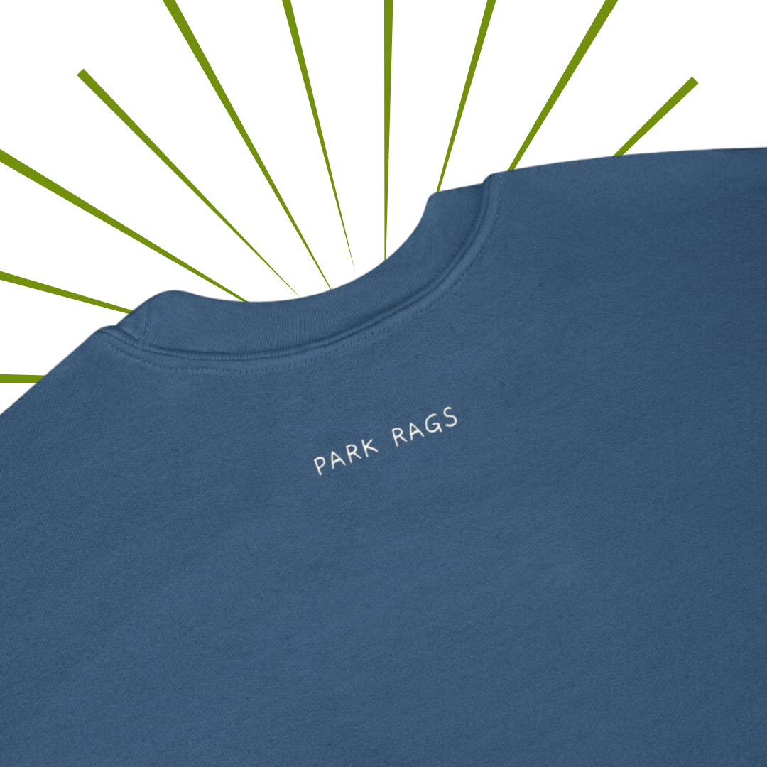 A detailed shot of the Park Rags logo located on the back of the sweatshirt in Indigo Blue, a few inches below the collar.