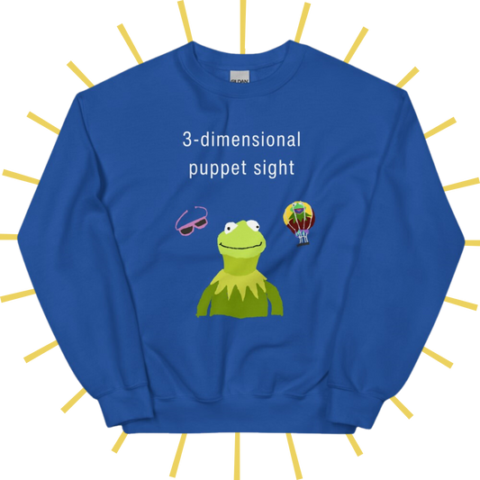 Front side of a bright blue sweatshirt with plain white text reading "3-dimensional puppet sight". Below that are three shakily rendered drawings, as if done on MS Paint. The most prominent drawing in the center is Kermit the Frog from the chest up, with one of his beady eyes slightly askew. To the left of his face is a pair of the pink 3D glasses given to guests at 3-dimensional puppet sight (aka Muppet*Vision 3D). To Kermit's right is a splotchy rendering of the hot air balloon outside the attraction.