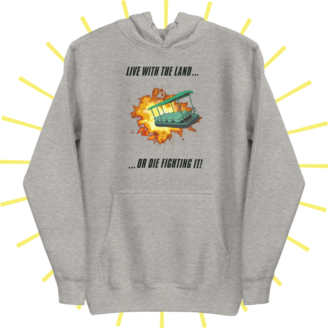 A grey heather hoodie (hood tucked behind) with a front pouch. The design includes top text in bold, black, italic uppercase lettering that reads: "LIVE WITH THE LAND..." The bottom text reads "...OR DIE FIGHTING IT!" Between the two lines of text is a drawing of the green ride vehicle from Living with the Land at Epcot narrowly escaping an explosion.