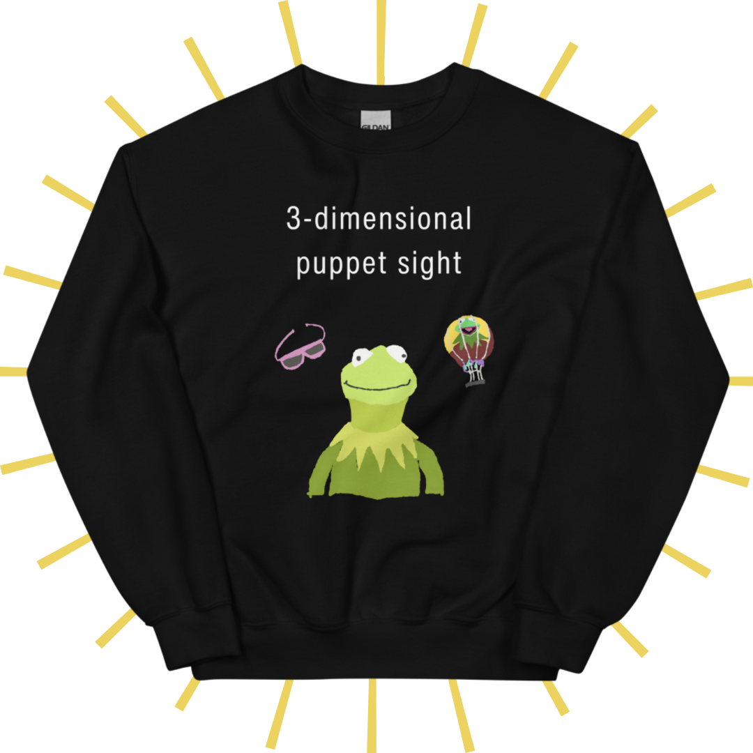 Front side of a black sweatshirt with plain white text reading "3-dimensional puppet sight". Below that are three shakily rendered drawings, as if done on MS Paint. The most prominent drawing in the center is Kermit the Frog from the chest up, with one of his beady eyes slightly askew. To the left of his face is a pair of the pink 3D glasses given to guests at 3-dimensional puppet sight (aka Muppet*Vision 3D). To Kermit's right is a splotchy rendering of the hot air balloon outside the attraction.