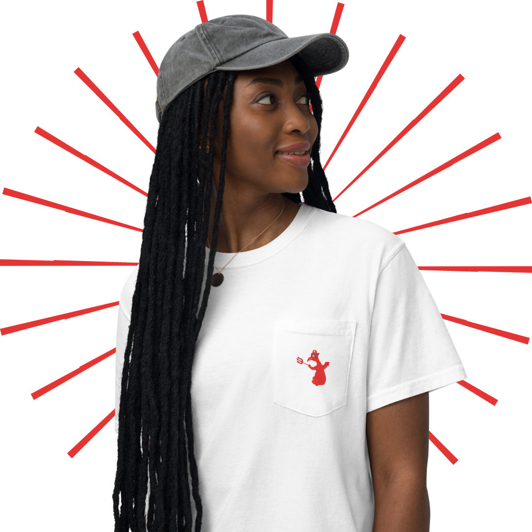 A young, slender black woman with long, extra medium-sized locs. She is wearing a grey, vintage-looking baseball cap and the white "Like, Really Wild" shirt. On the front of the shirt we can see a small pocket on the left hand side of the shirt with the little red devil dude from the Hell scene in Mr. Toad's Wild Ride. She looks past her left shoulder with a slightly pleasant gaze. 