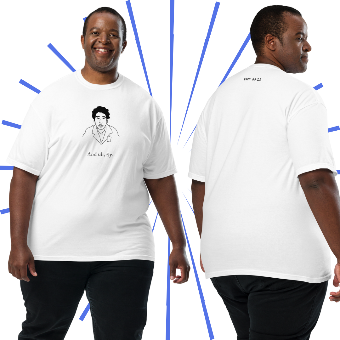 Two shots of a heavyset Black man wearing the "And Uh Fly" shirt. On the left he appears to be walking and smiling. On the right, his back is facing the camera as he looks over his right shoulder with a neutral gaze.