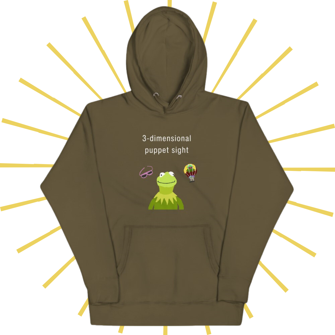 Front side of a murky green hoodie with plain white text reading "3-dimensional puppet sight". Below that are three shakily rendered drawings, MS Paint style. In the center is Kermit the Frog from the chest up, with one of his beady eyes slightly askew. To the left of his face is a pair of the pink 3D glasses given to guests at 3-dimensional puppet sight (aka Muppet*Vision 3D). To Kermit's right is a splotchy rendering of the hot air balloon outside the attraction. There is also a pouch towards the bottom.