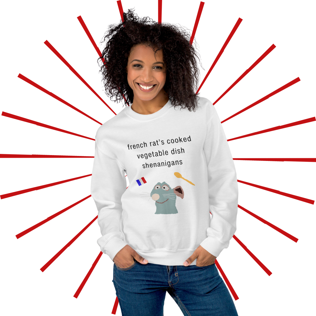 A young, slender woman of color with curly, dark brown hair wearing the French Rat sweatshirt. She faces the viewer smiling while placing her fingers in the front pockets of her jeans.