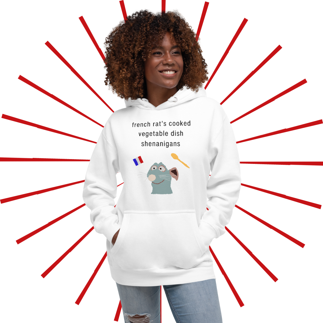 Slender black woman with brown, curly hair wearing the white French Rat hoodie with a pair of light blue, ripped jeans. She has her hands placed in the front pouch and she gazes towards her left, smiling.