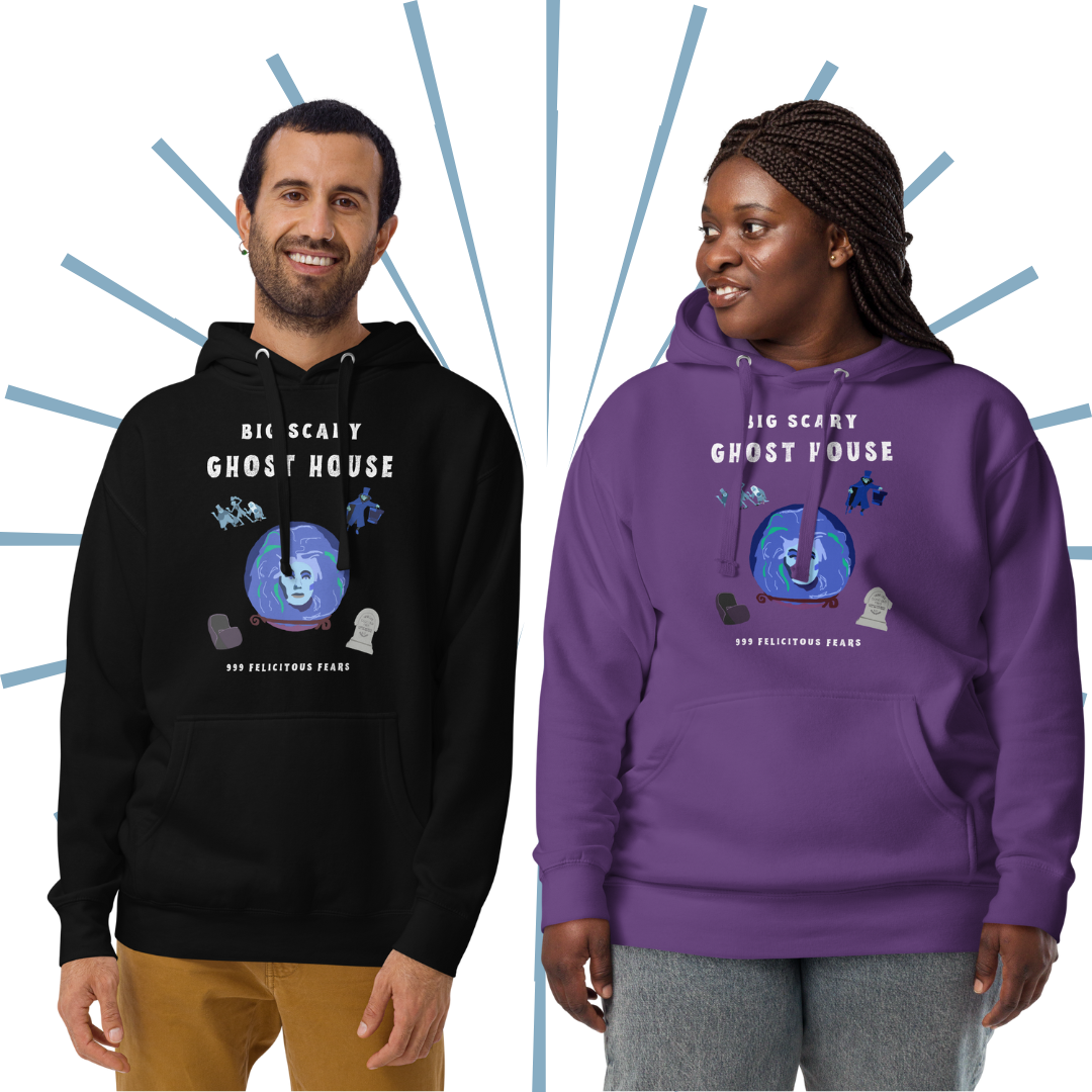 Two models standing beside each other. The Caucasian male model on the left wears the black version of the hoodie as he faces the viewer, smiling. The Black female model on the right wears the purple version, looking off to her right pleasantly.