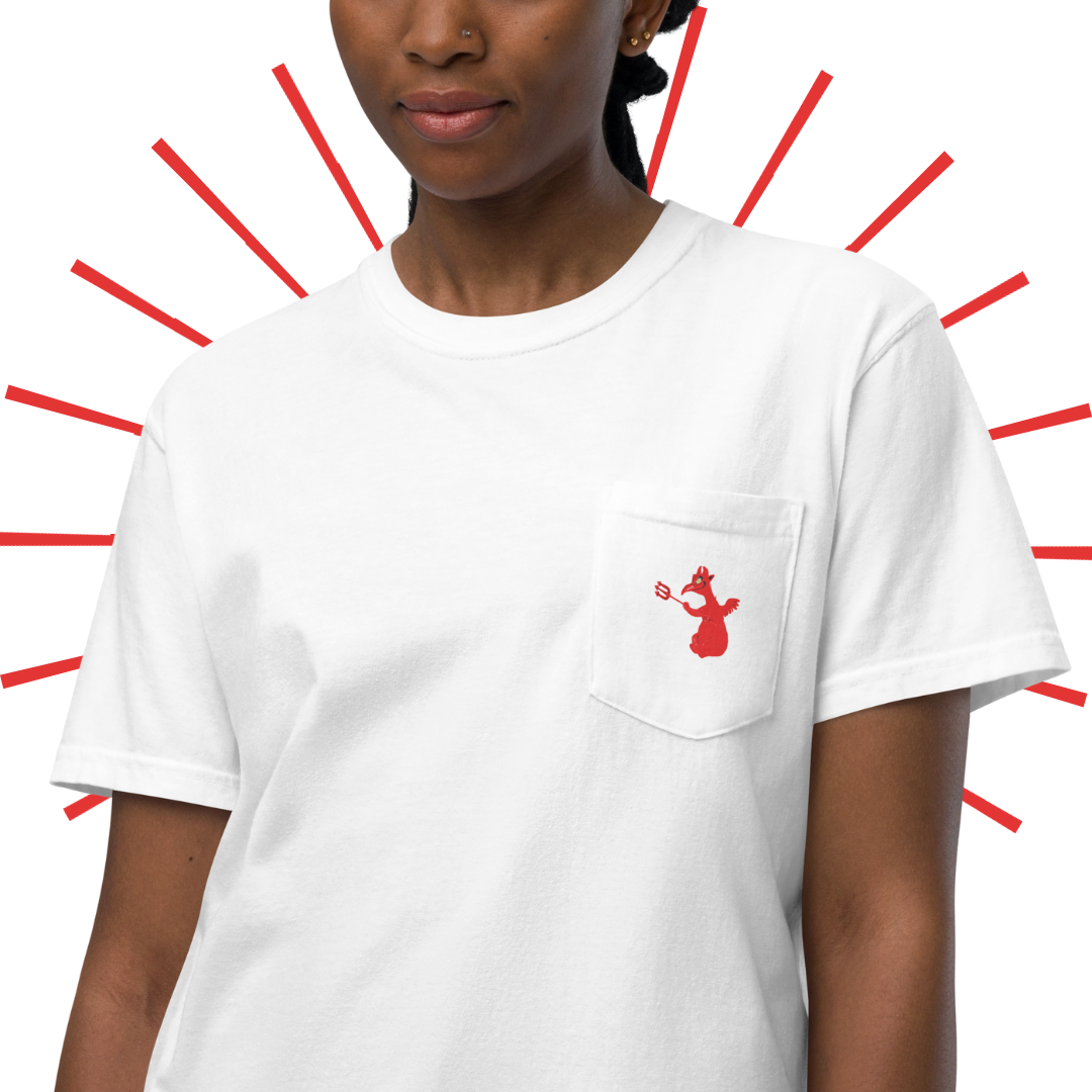 A closer shot of the front of the shirt, as worn by a young, slender Black woman. The little red devil dude design on the front pocket can be seen in more detail.