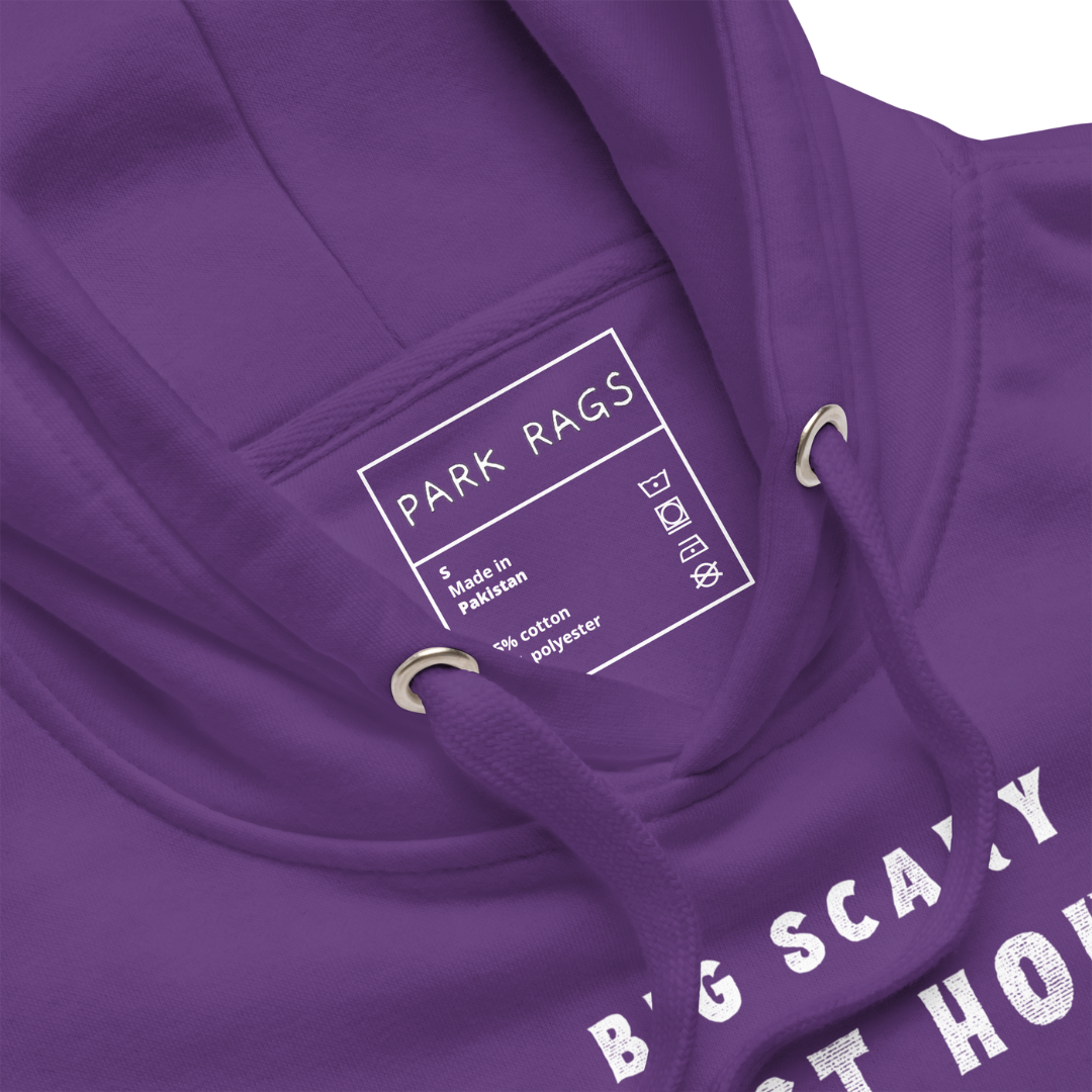 A detail shot of the purple hoodie's inner label. It is white with the Park Rags logo, along with the size, information about the garment's material, and care instruction symbols.