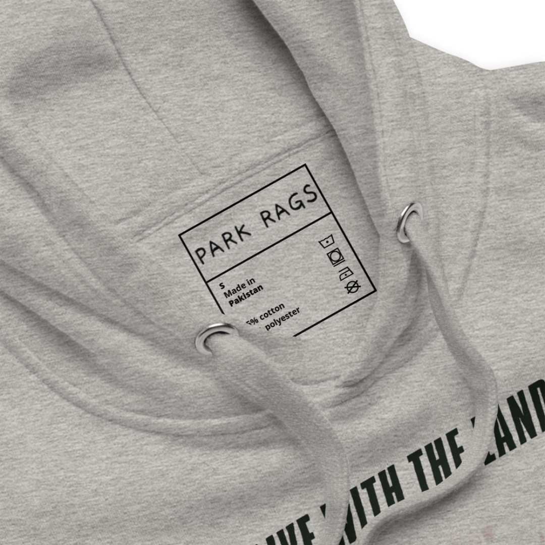 Detailed shot of the hoodie's inside label. it is printed rather than sewn on. It contains the Park Rags logo and indicated it is a size small, Made in Pakistan, and includes the material as well as washing instruction symbols.